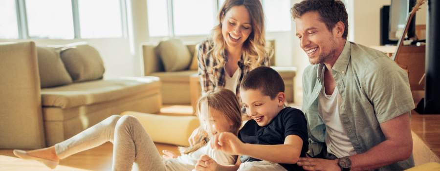 Family Having Fun Together In Living Room
